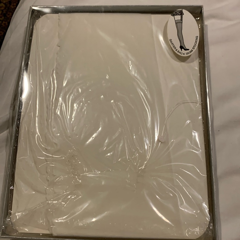 Vintage white nylon stockings unopened.  Size SM/MED